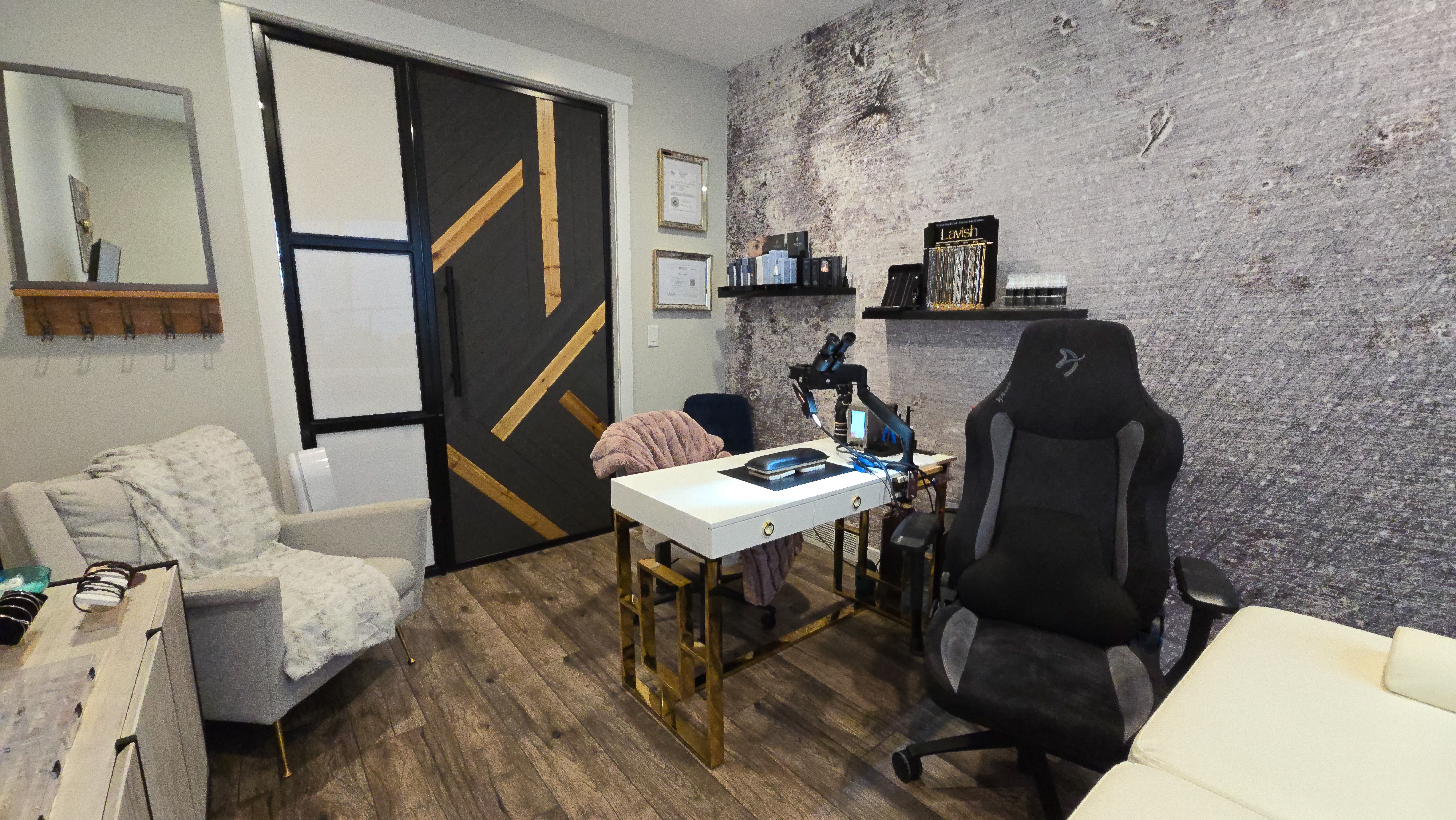 Permanent jewelry studio interior with chain displays and work area